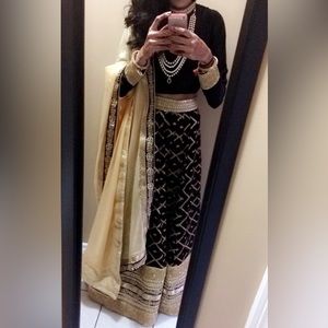 Selling a custom made lengha in black with gold hand work & gota patti.